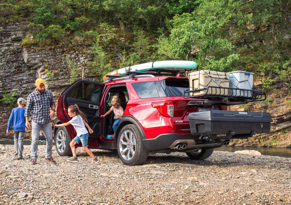 Yakima EXO System: SwingBase, TopShelf, GearWarrior & GearLocker installed on back of loaded SUV loaded with coolers