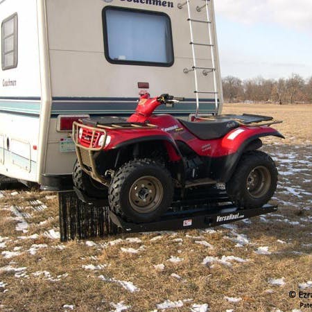 VersaHaul ATV carrier loaded with red atv on back of RV