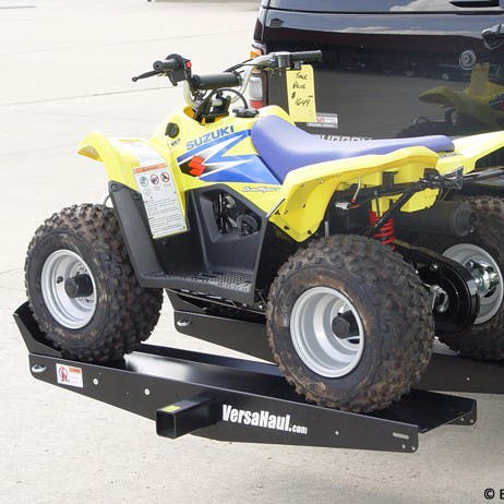 VersaHaul Lawn and Garden Mini loaded with small atv on back of suv angled view