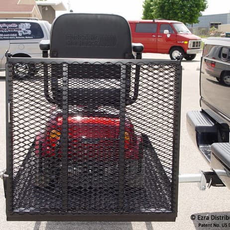 Versahaul mobility scooter carrier installed on back of truck with ramp up loaded with scooter