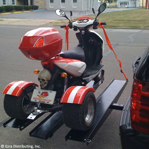 VersaHaul Trike Scooter carrier loaded with trike on back of suv side back view