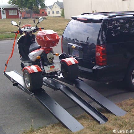 VersaHaul Trike Scooter carrier with extended ramps installed on SUV loaded with trike
