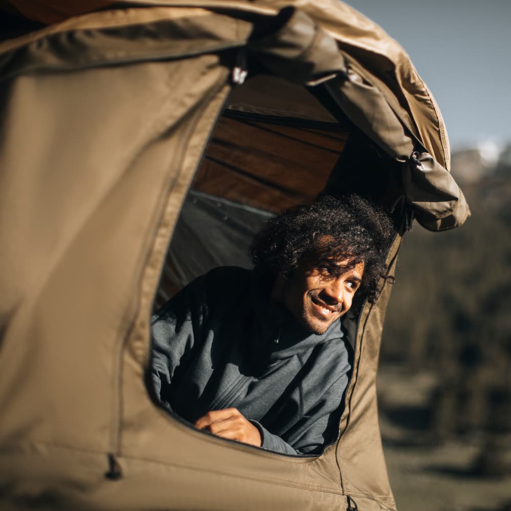 Thule Approach Rooftop Tent Occupied with person camping