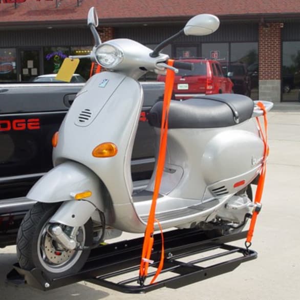 VersaHaul 50cc Scooter Carrier on back of vehicle loaded with scooter